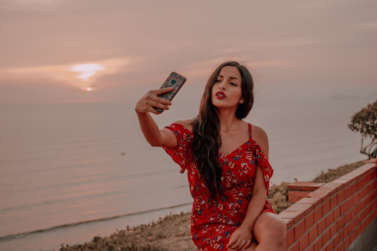 girl posing for selfie outdoors