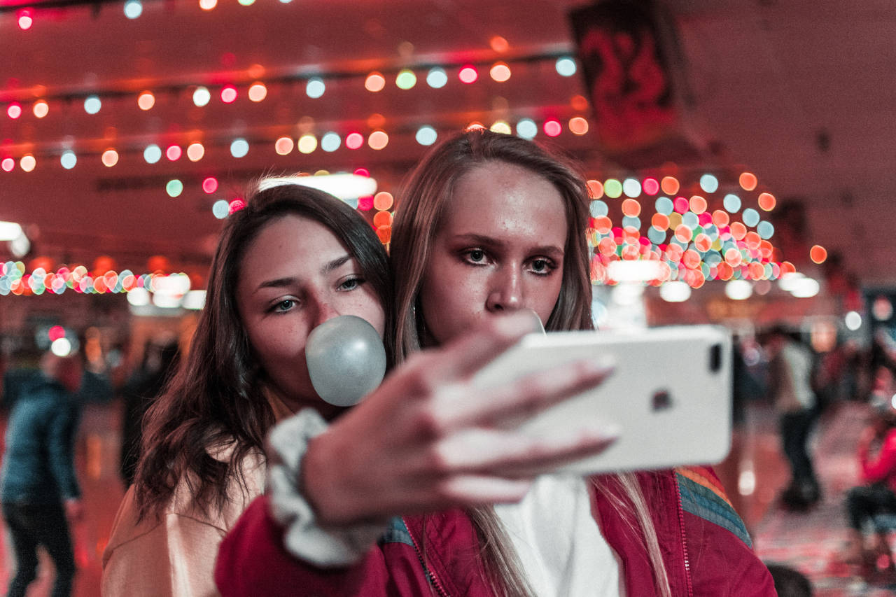 two girls posing for a selfie